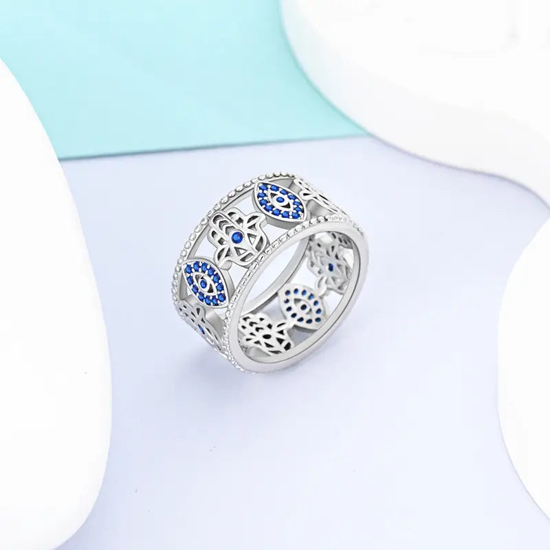 MULA S925 Silver-Plated Wide Ring — Featuring a Blue "Evil Eye" and Hamsa Hand Design Accented with Cubic Zirconia; a Crystal Piece with Spiritual Significance, Making It an Ideal Gift for Girls and Women.